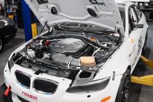 BMW Track Car on a lift getting prepped for the track