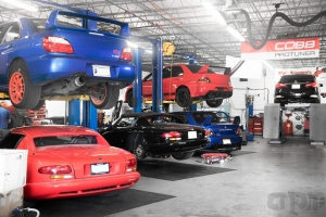 Shot of Shop with two vipers, one subaru sti and two mitsubishi evo 9