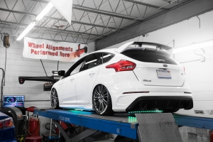Ford Focus RS On alignment rack with air suspension bags and underglow